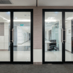 Empty glass door with black Aluminium frame in office building for wall backgroud