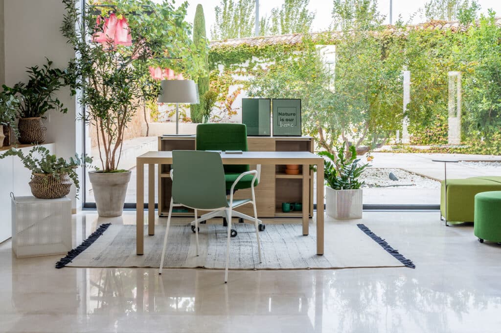 a home office setup with natural touch infront of the garden