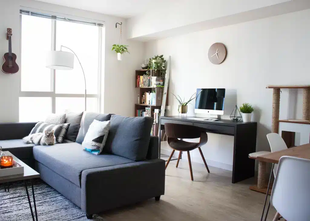 a living room blended with the home office setup