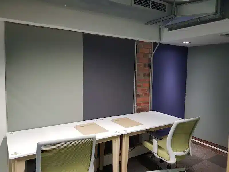 fabric walls design along with table and office chairs