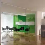 glass doors in the office along with furniture