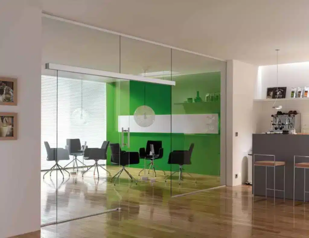 glass doors in the office along with furniture