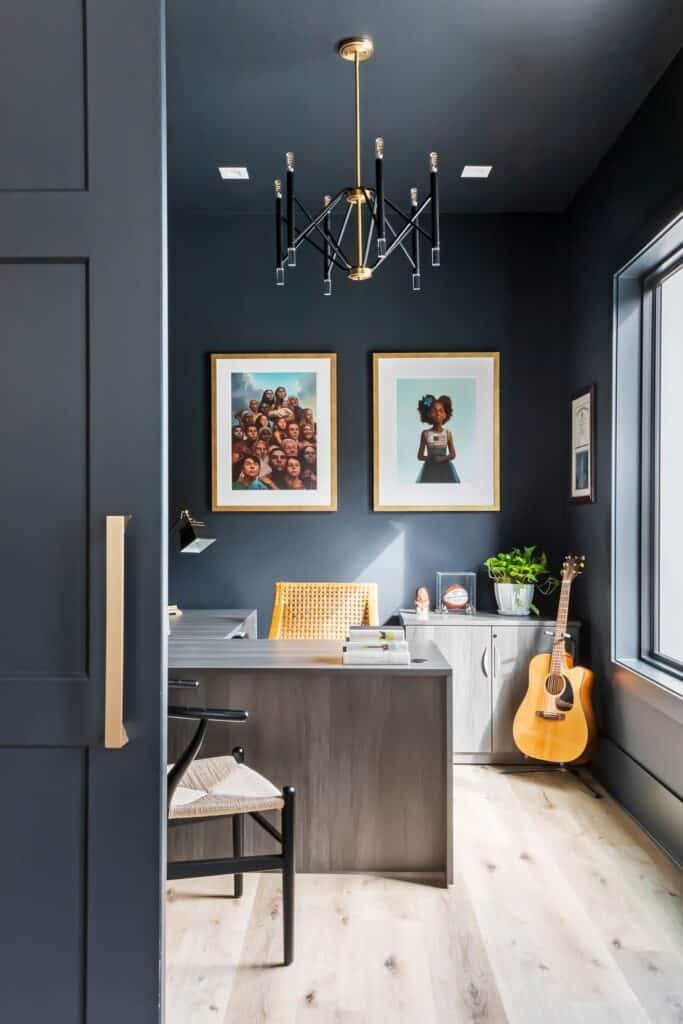 dark black wall paint art pieces on wall lighting fixture guitar placed with a small storage