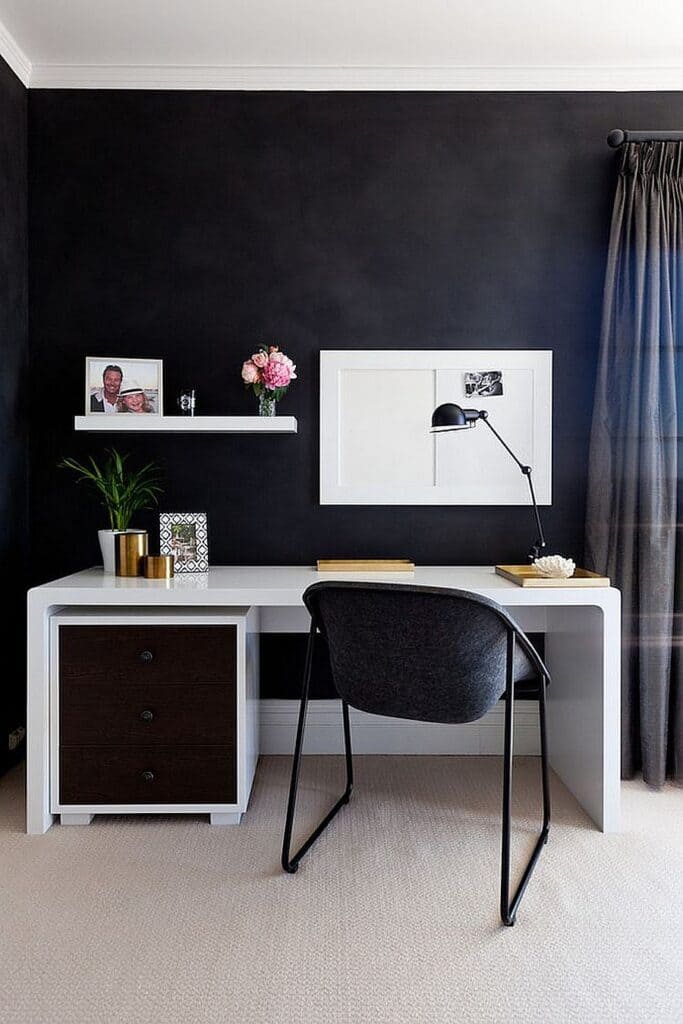 dark home office corner a chair white working desk and a lamp