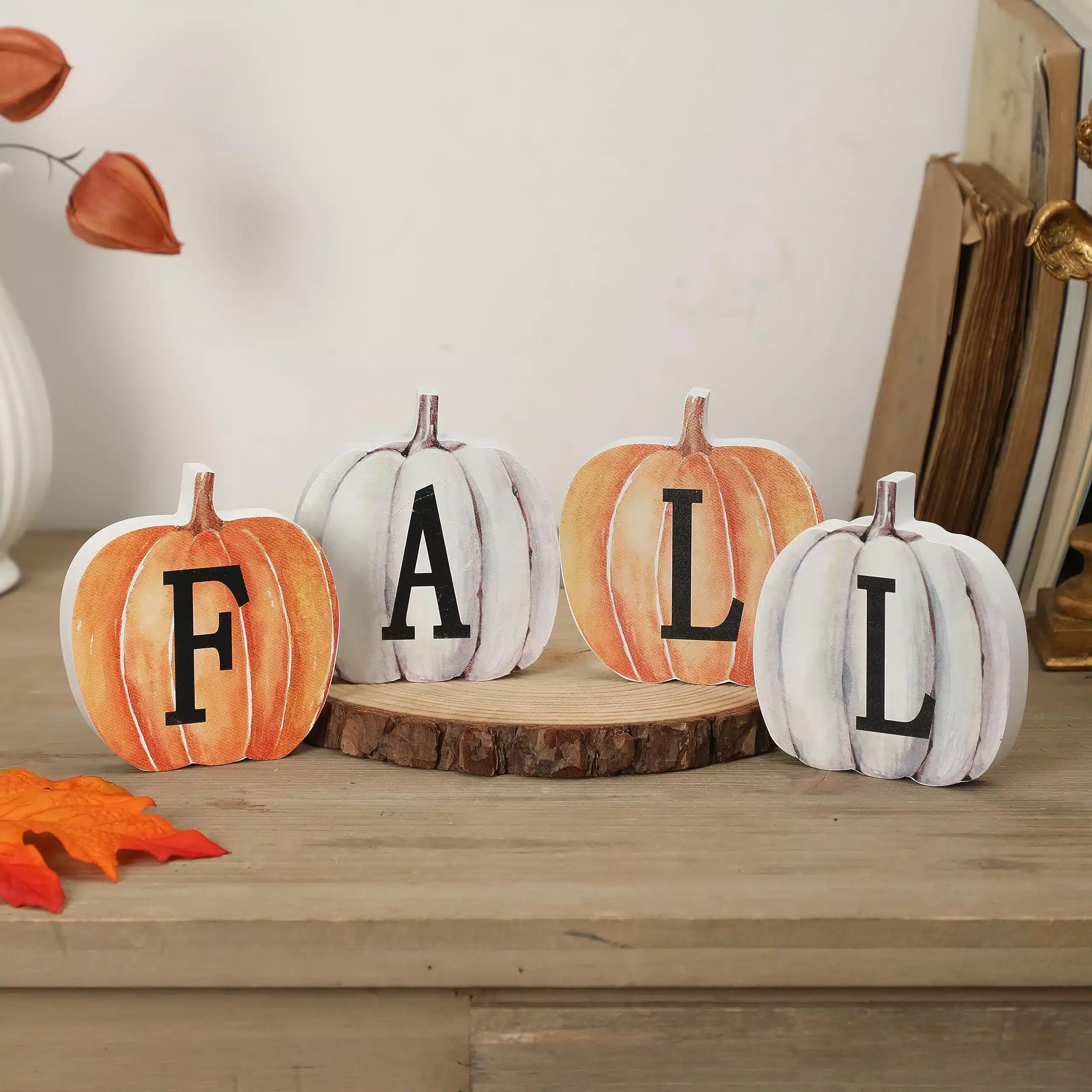 artificial fall pumpkins on a table