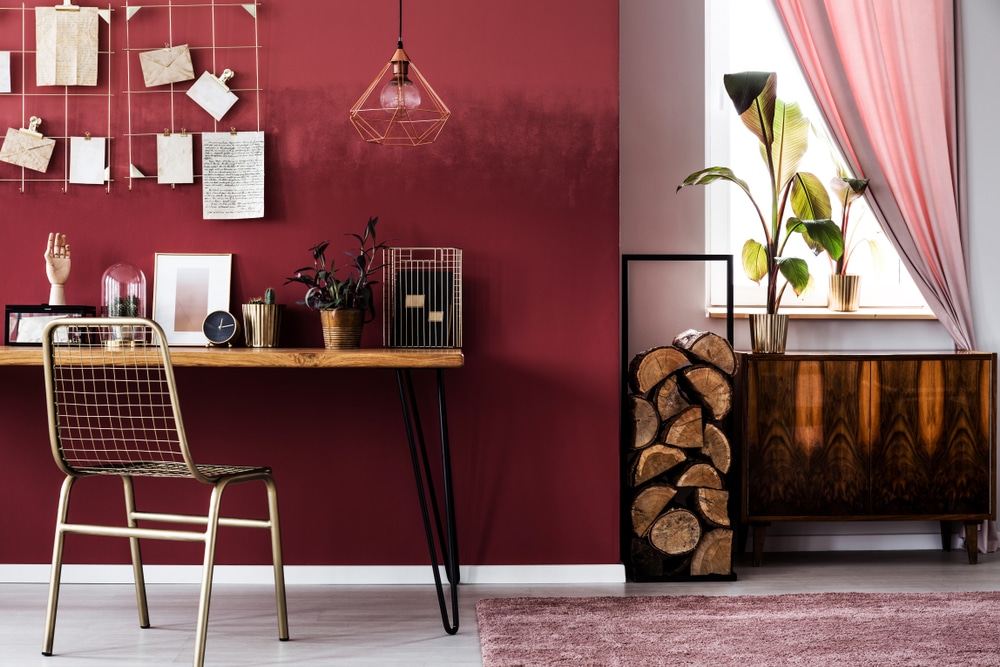 Cupboard And Logs Of Wood Next To A Metal Chair, pink rug