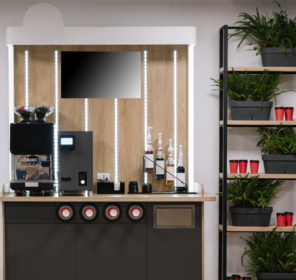 Stylish Coffee Area With Machine And Accessories In A Contemporary Office Setting