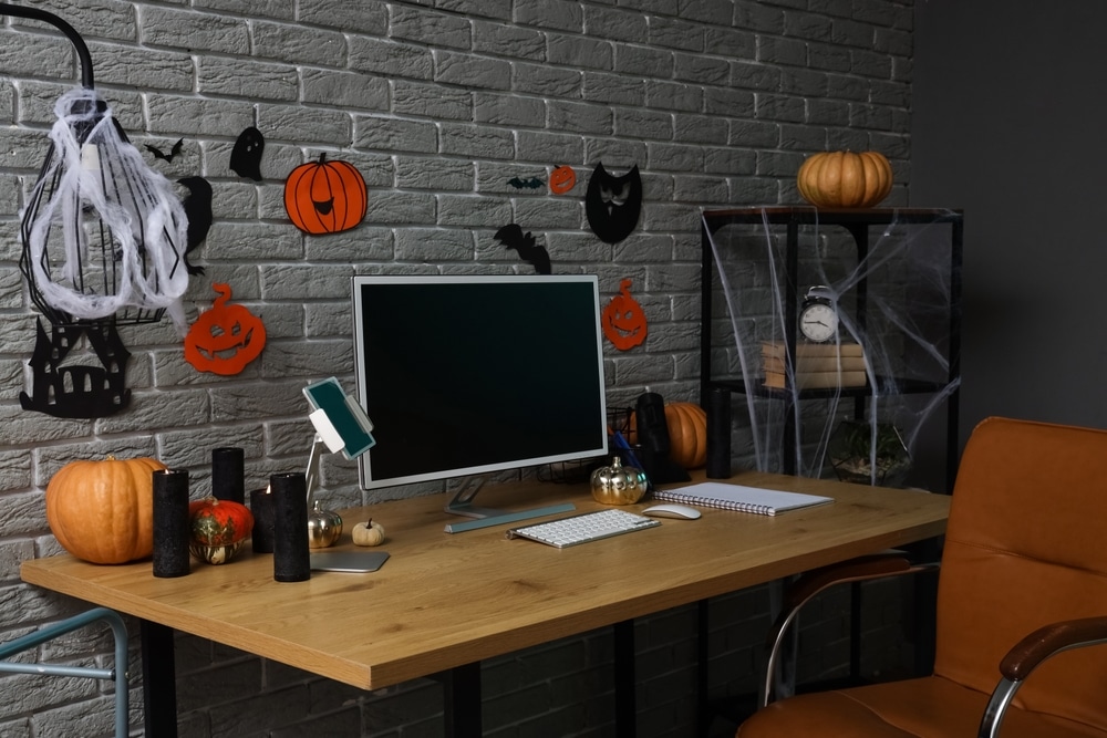 Interior Of Dark Office Decorated For Halloween With Workplace And