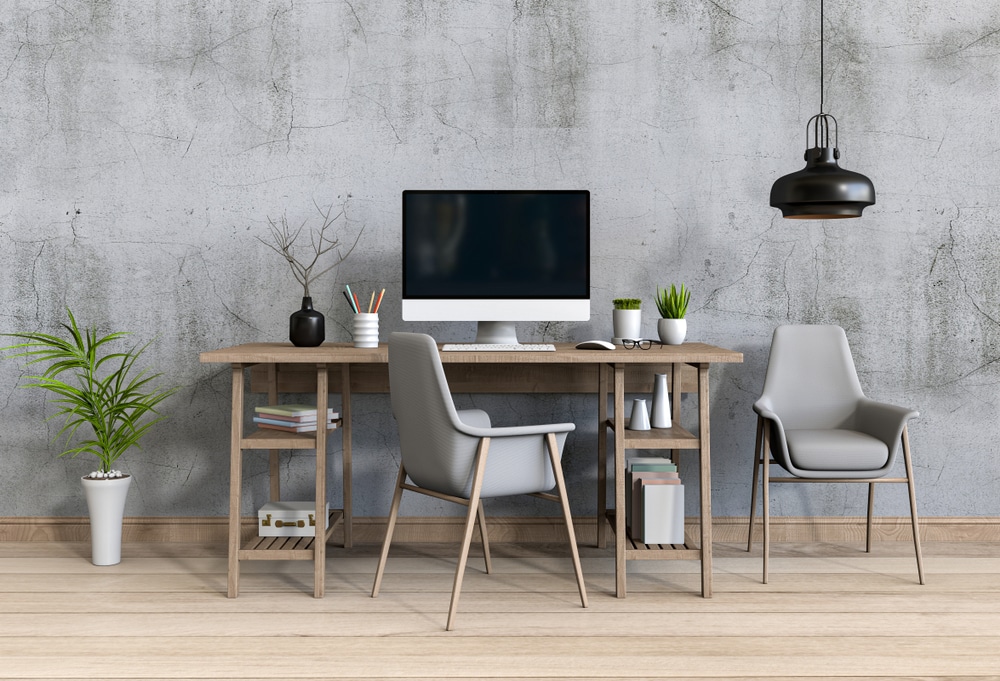 desktop on a table small pots chairs a hanging light fixture